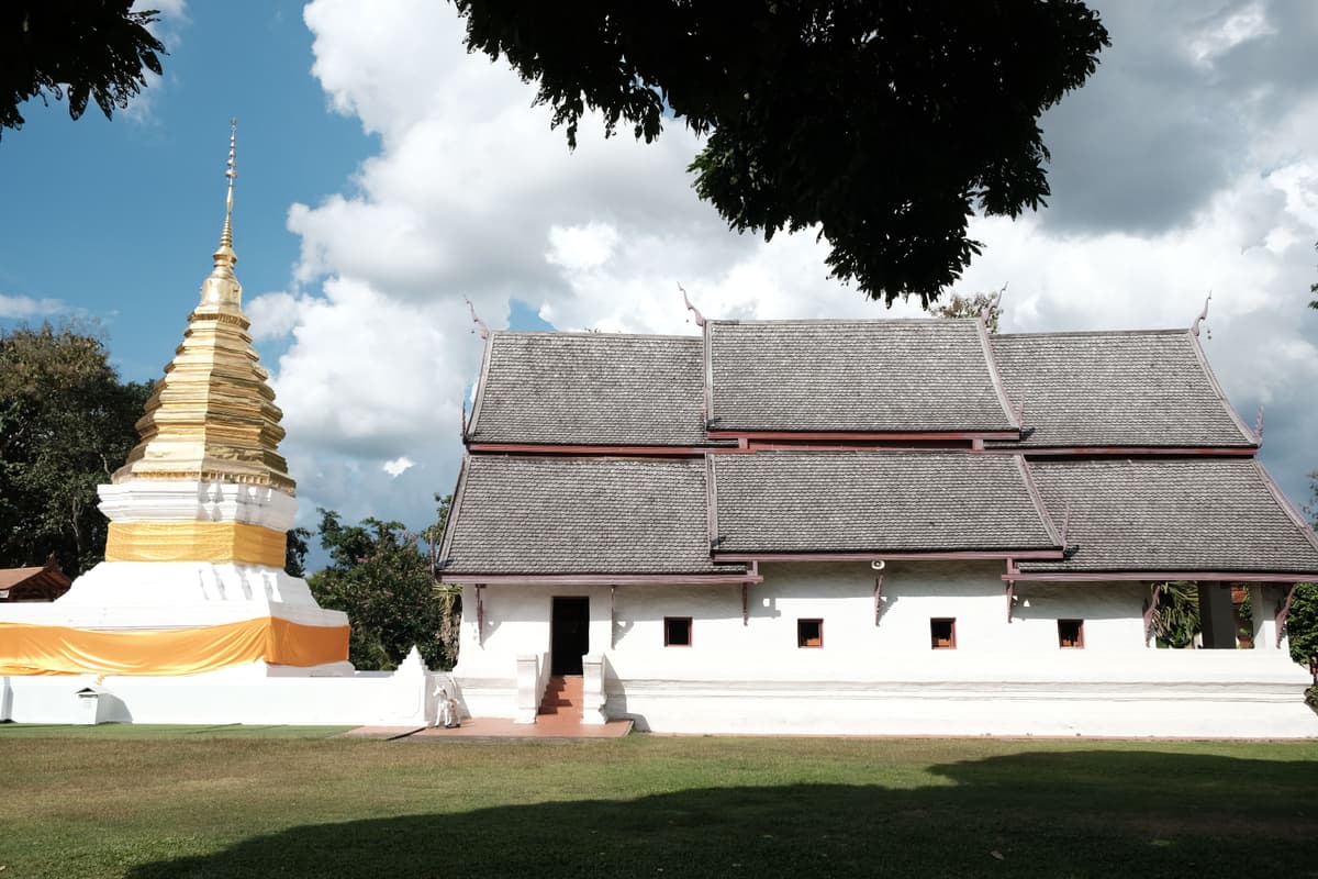 Beautiful Pai temple with mountain backdrop
