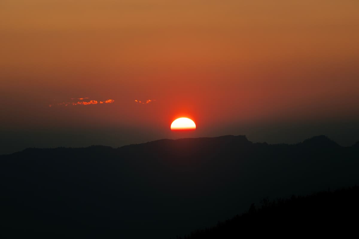 Stunning Pai sunset over mountains and rice fields