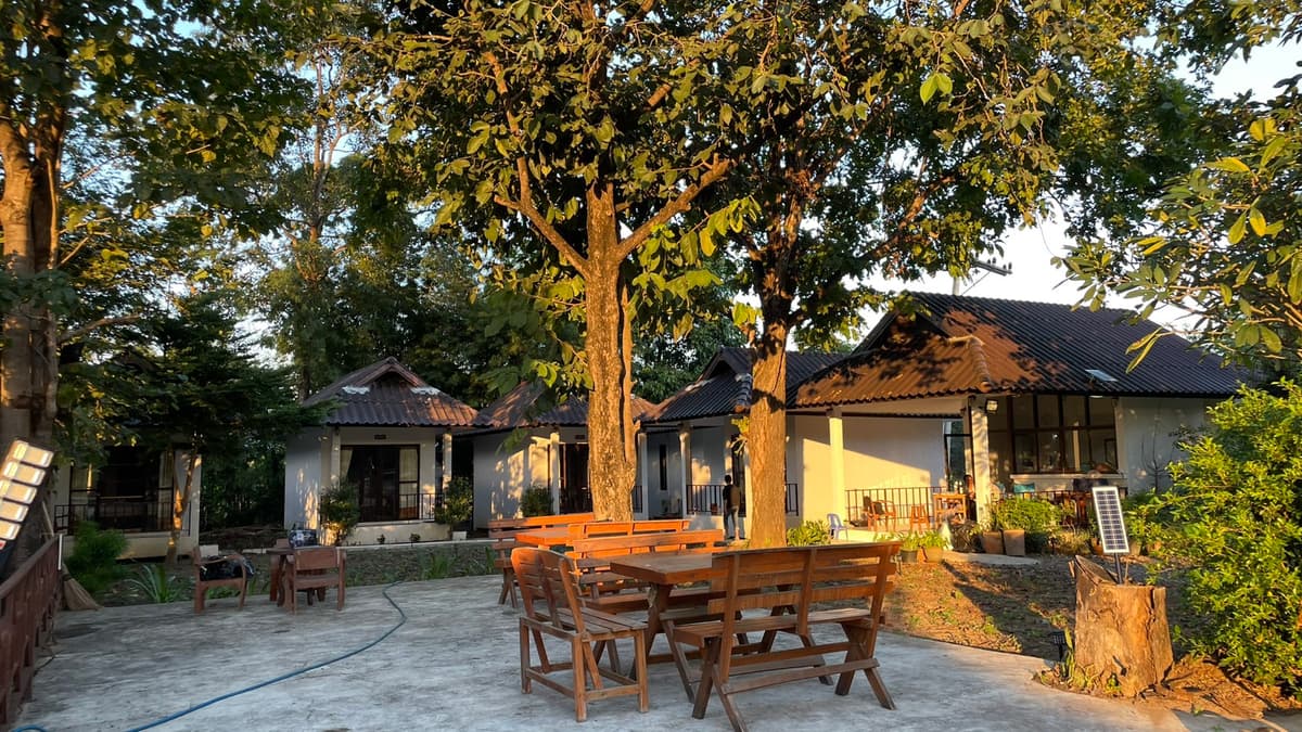 Cozy room interior with comfortable bed at A-Thip House Pai
